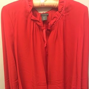 Red blouse, ruffled neckline